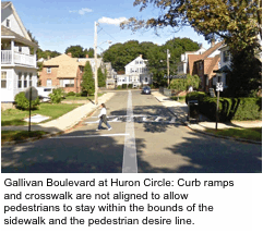 Gallivan Boulevard at Huron Circle: Curb ramps and crosswalk are not aligned to allow pedestrians to stay within the bounds of the sidewalk and the pedestrian desire line.
